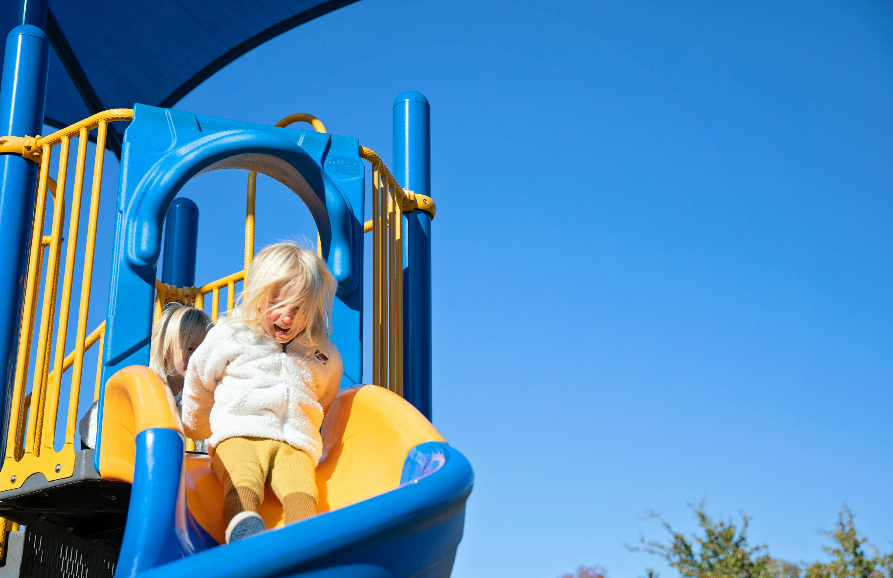 Picture of a girl going down a slide