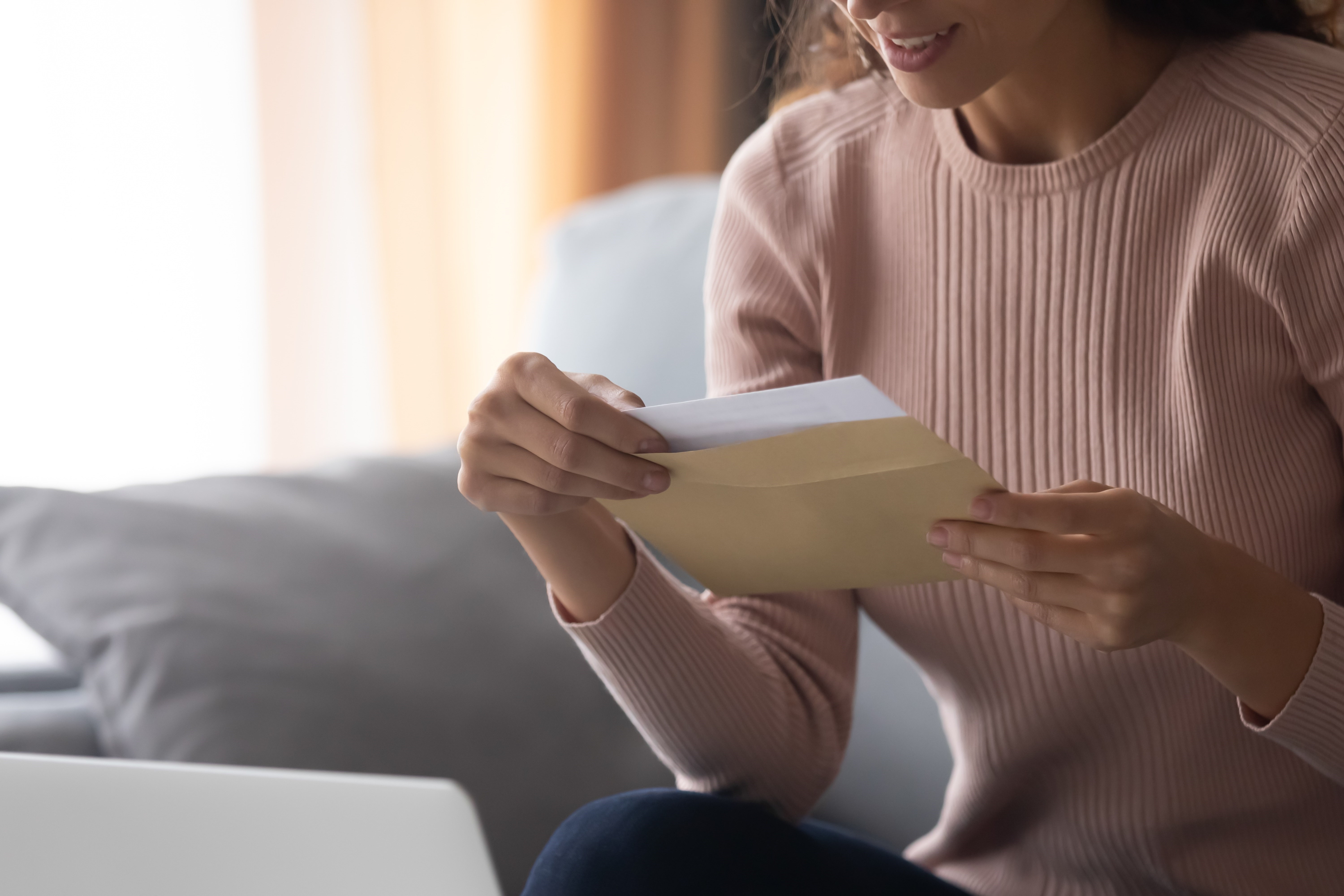 Girl holding a paper with an envelope