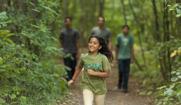 Picture of a family walking on a trail