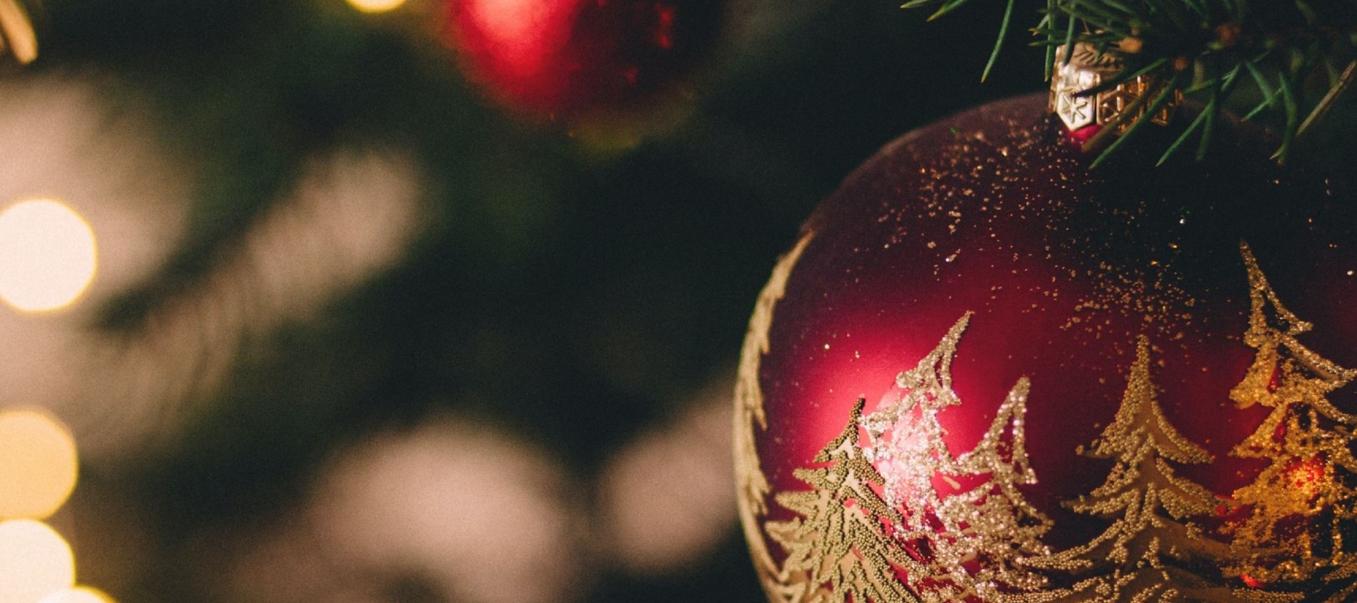 Christmas tree focused on red Christmas ball