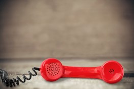 Picture of a red phone on the ground